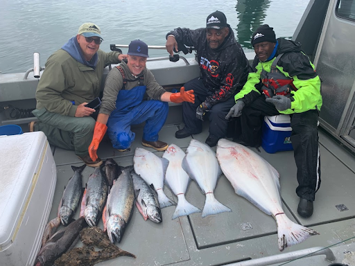 Family and friends pointing at large catches of fish. Greg M. recommendation of Alaskan Anglers. Taken from https://www.google.com/maps/uv?pb=!1s0x5401987df2c3f631%3A0x15bfdd91cc2bb758!3m1!7e115!5sGoogle%20Search!15sCgIgAQ&hl=en&imagekey=!1e10!2sAF1QipMC9gxRpJ4C3GjmreSZqvLDbcF0xm_vH99dYlQK&sa=X&ved=2ahUKEwjZ38SF0oTzAhXjdN8KHWU2A0EQ9fkHKAR6BAgBECg