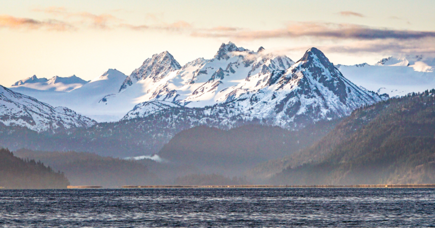 Beautiful ocean and mountains in Alaska seen from fishing trip.