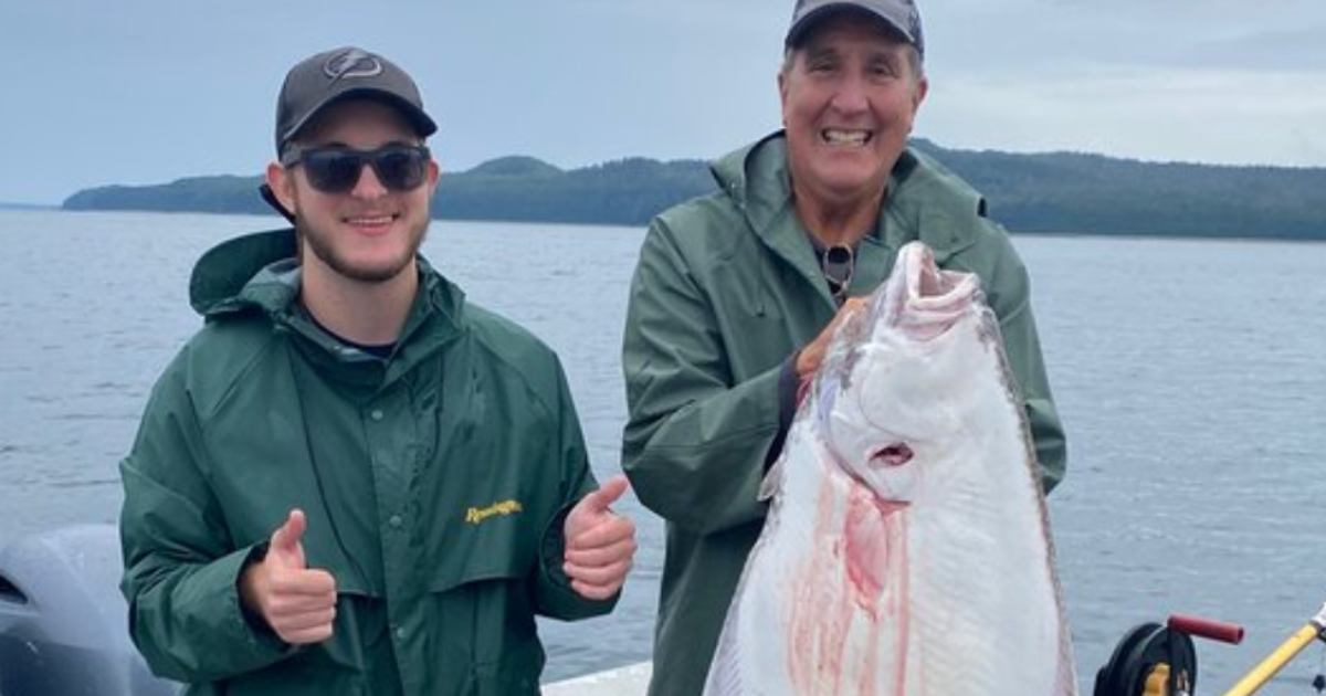 Grandfather and Grandson, Glenn and Owen, posing with their catches of the day from Alaskan Anglers.
