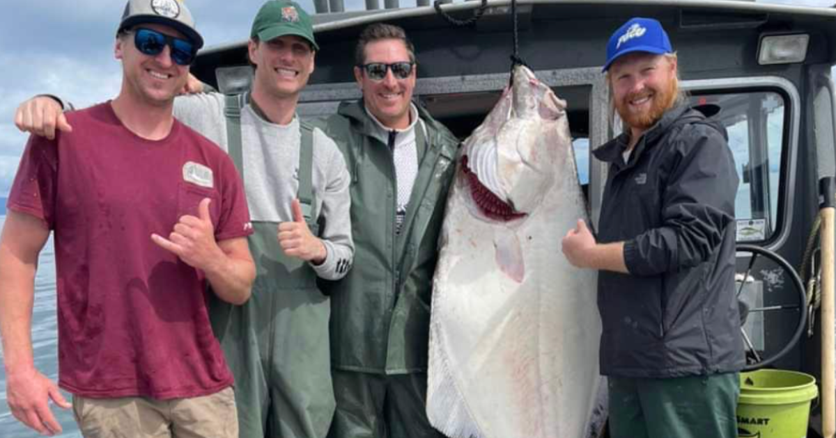 Alaskan Anglers guests posing with Halibut.